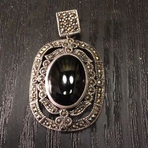 Filigree and black onyx pendant